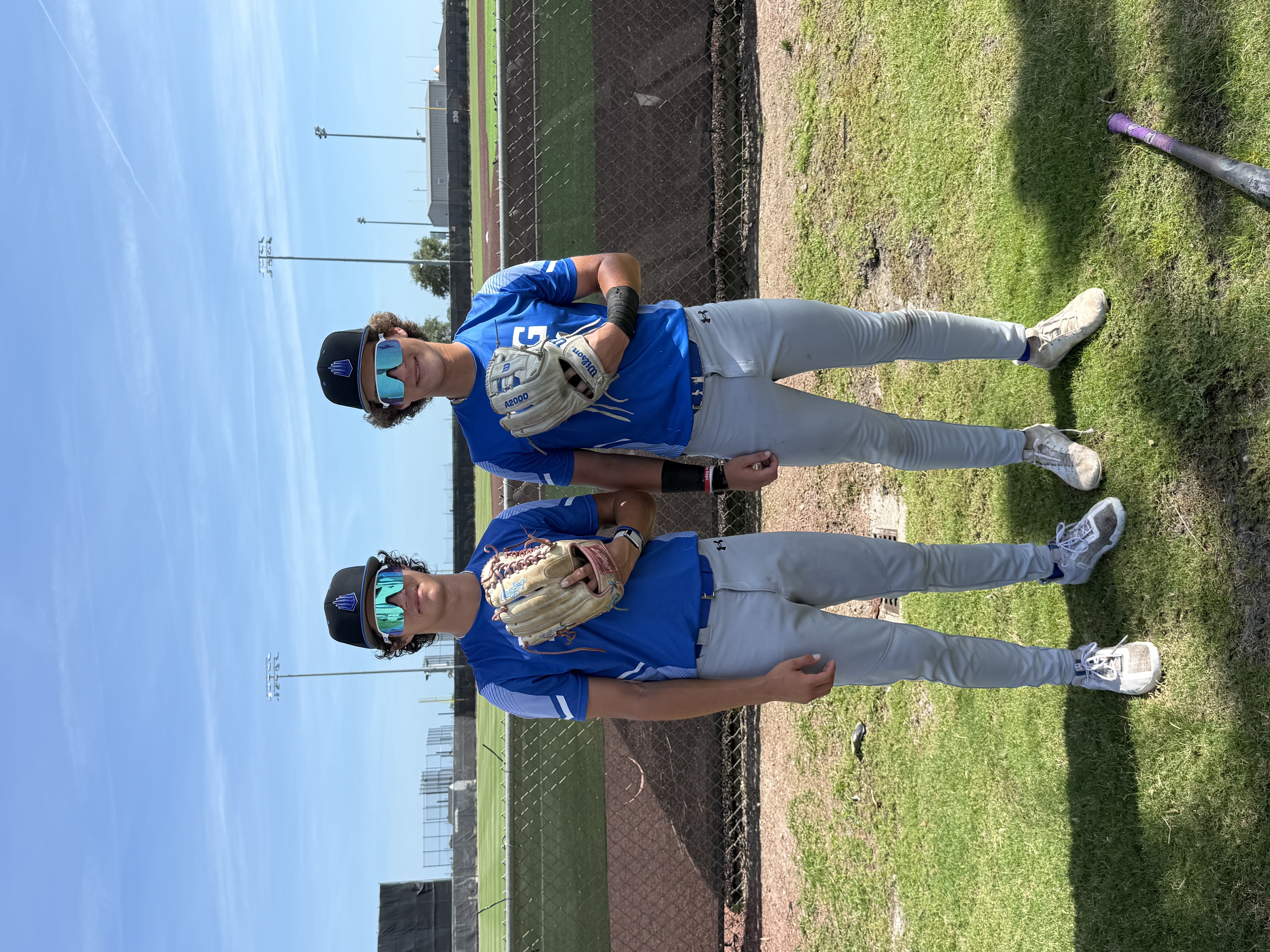 James and Jake on the field with baseball gloves