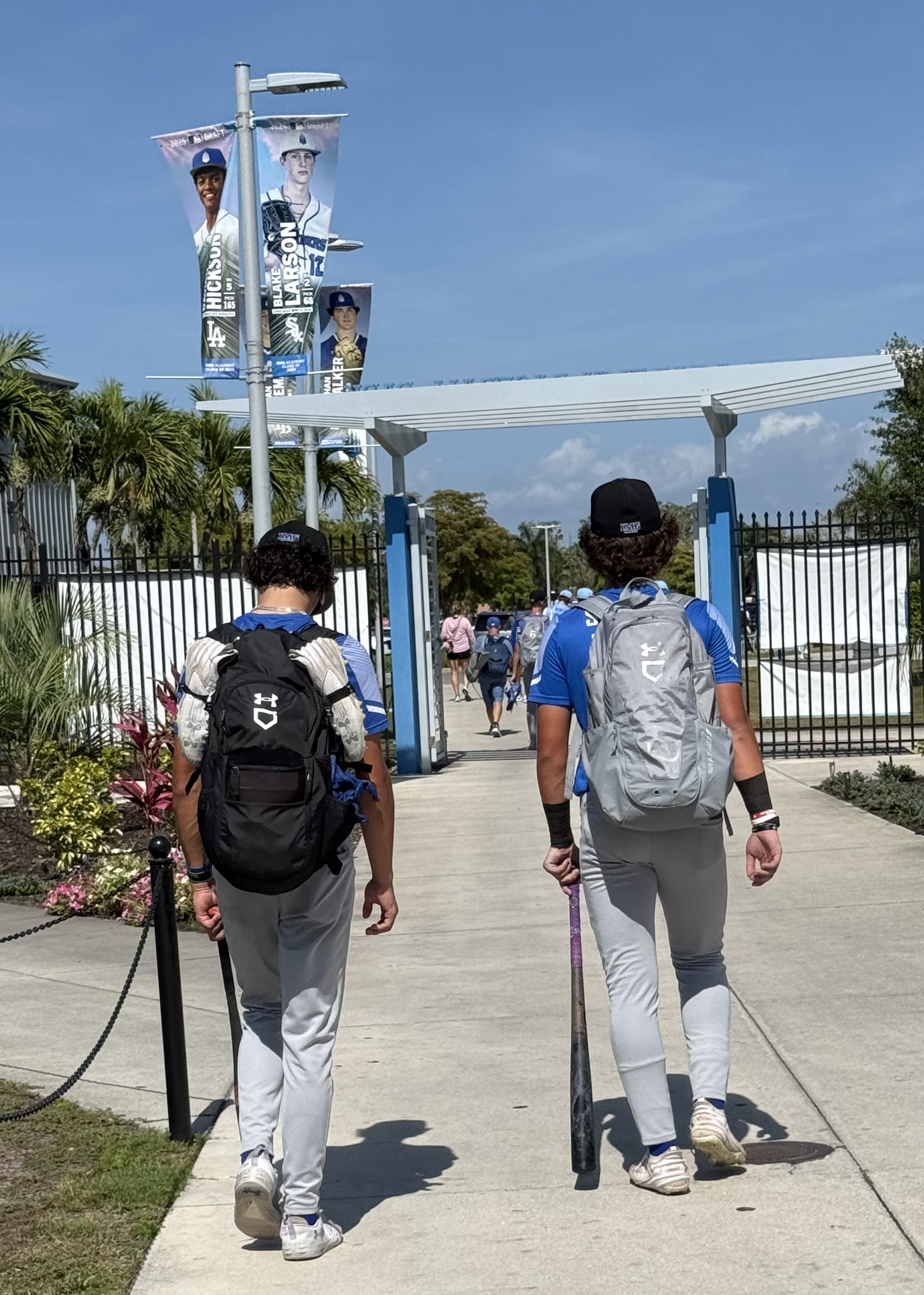 James and Jake walking into IMG Academy with baseball gear